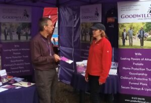 Michael RRhpoes from Goodwills Local interacting with a potential client at a local event